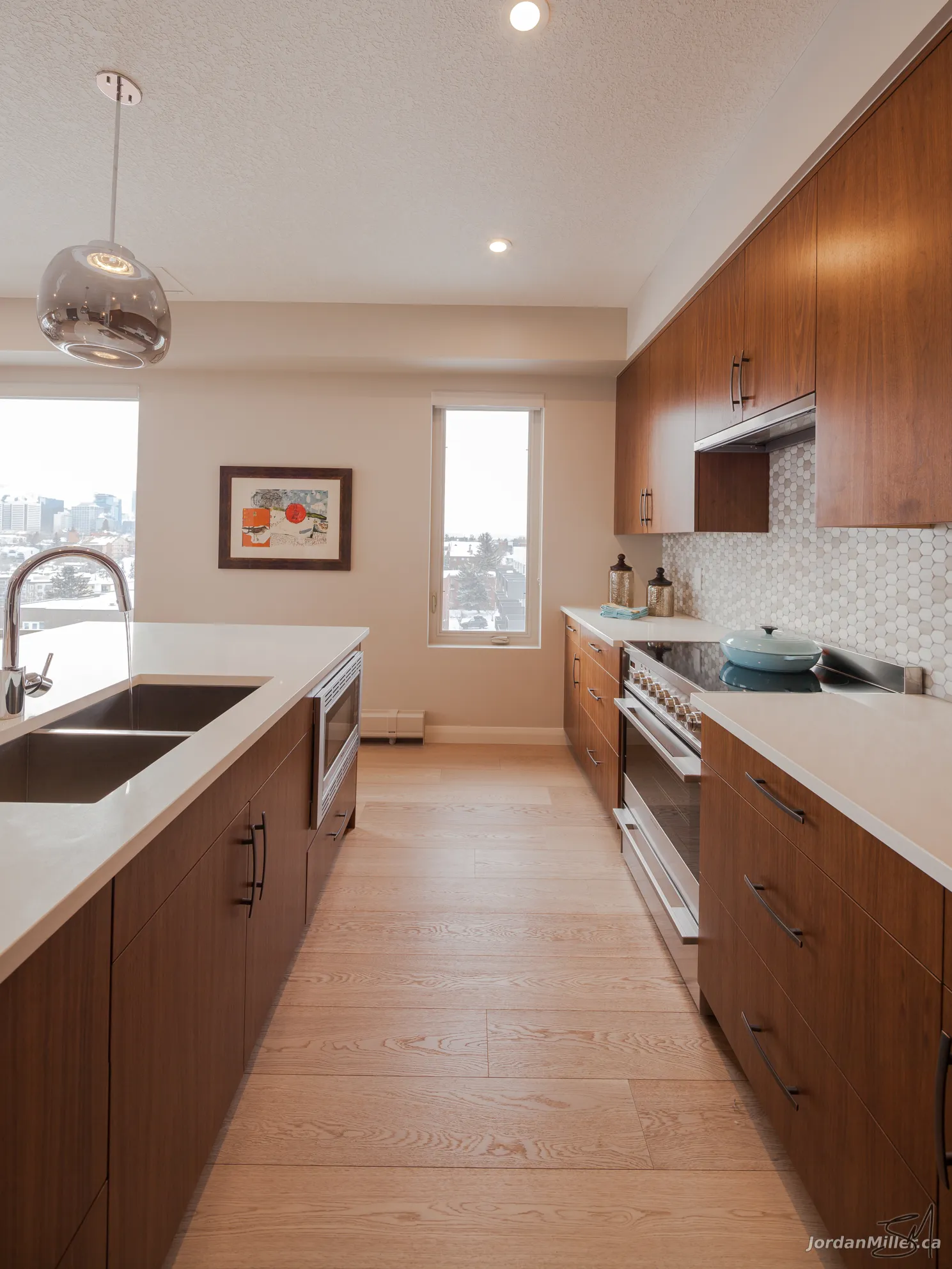 Kitchen with quartz island and pendant lighting